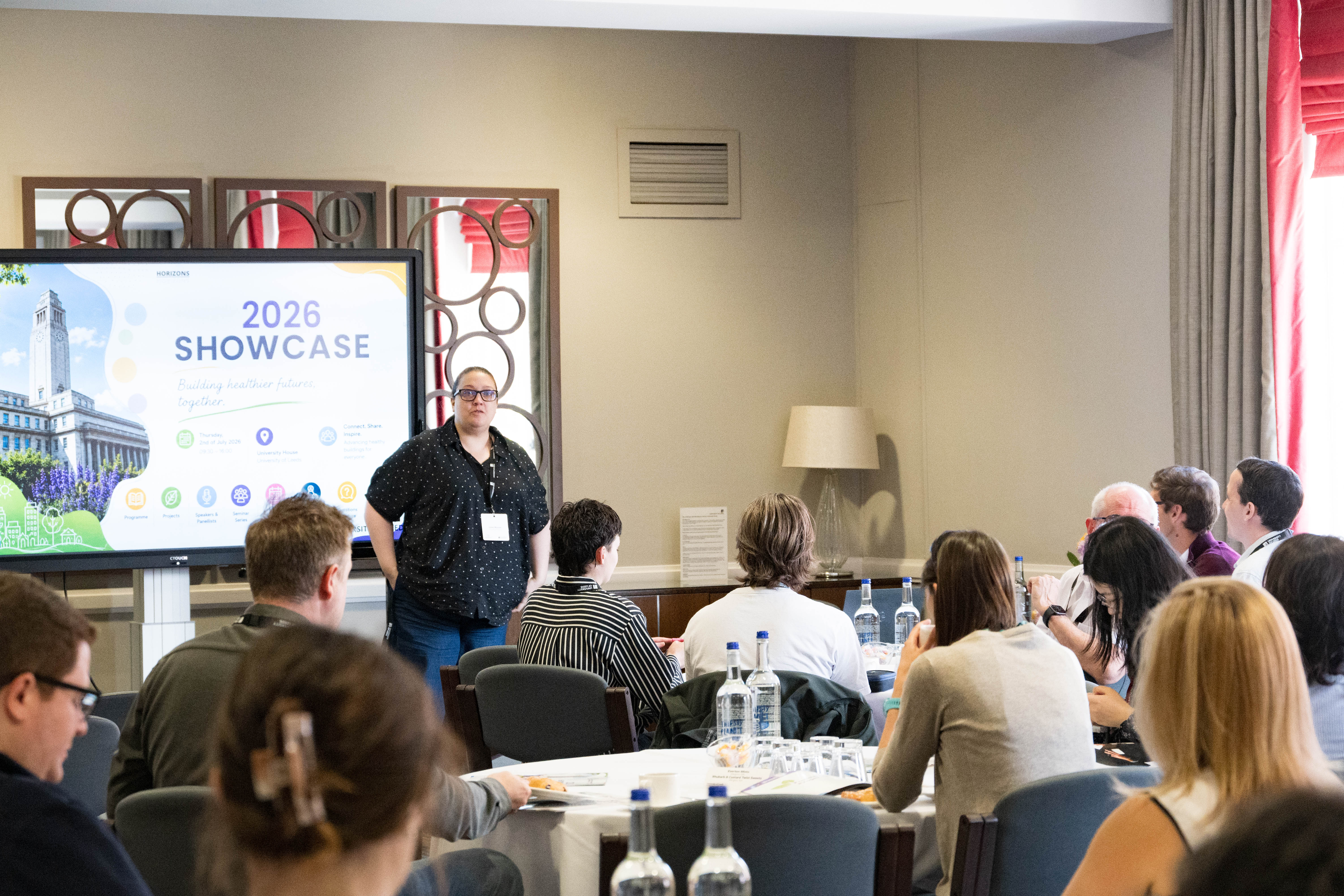 The room at the HBN Showcase 2026 opening — Dr Irene Mussio at the front with the full audience