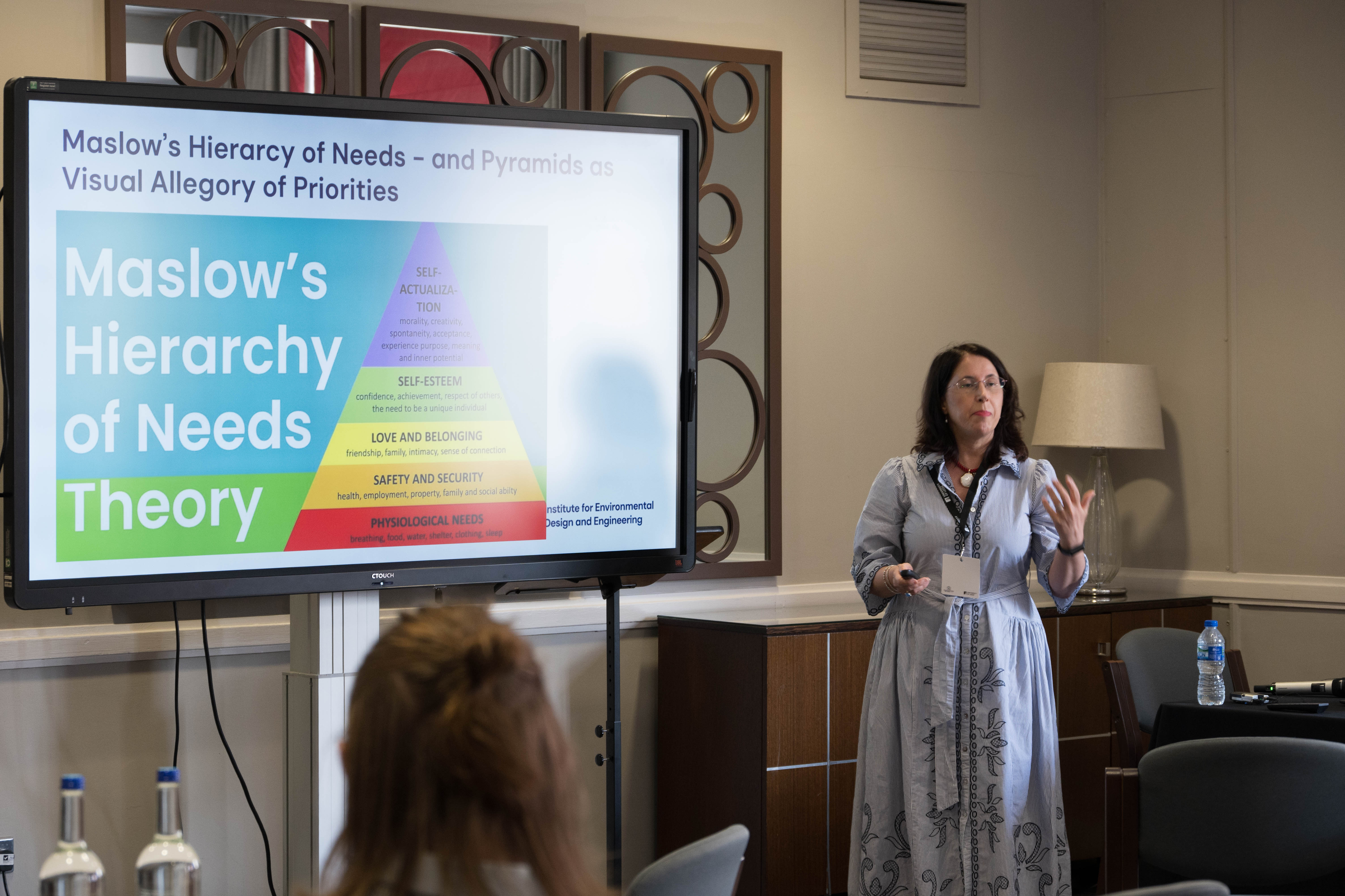 Prof. Marcella Ucci keynote with Maslow's Hierarchy of Needs slide