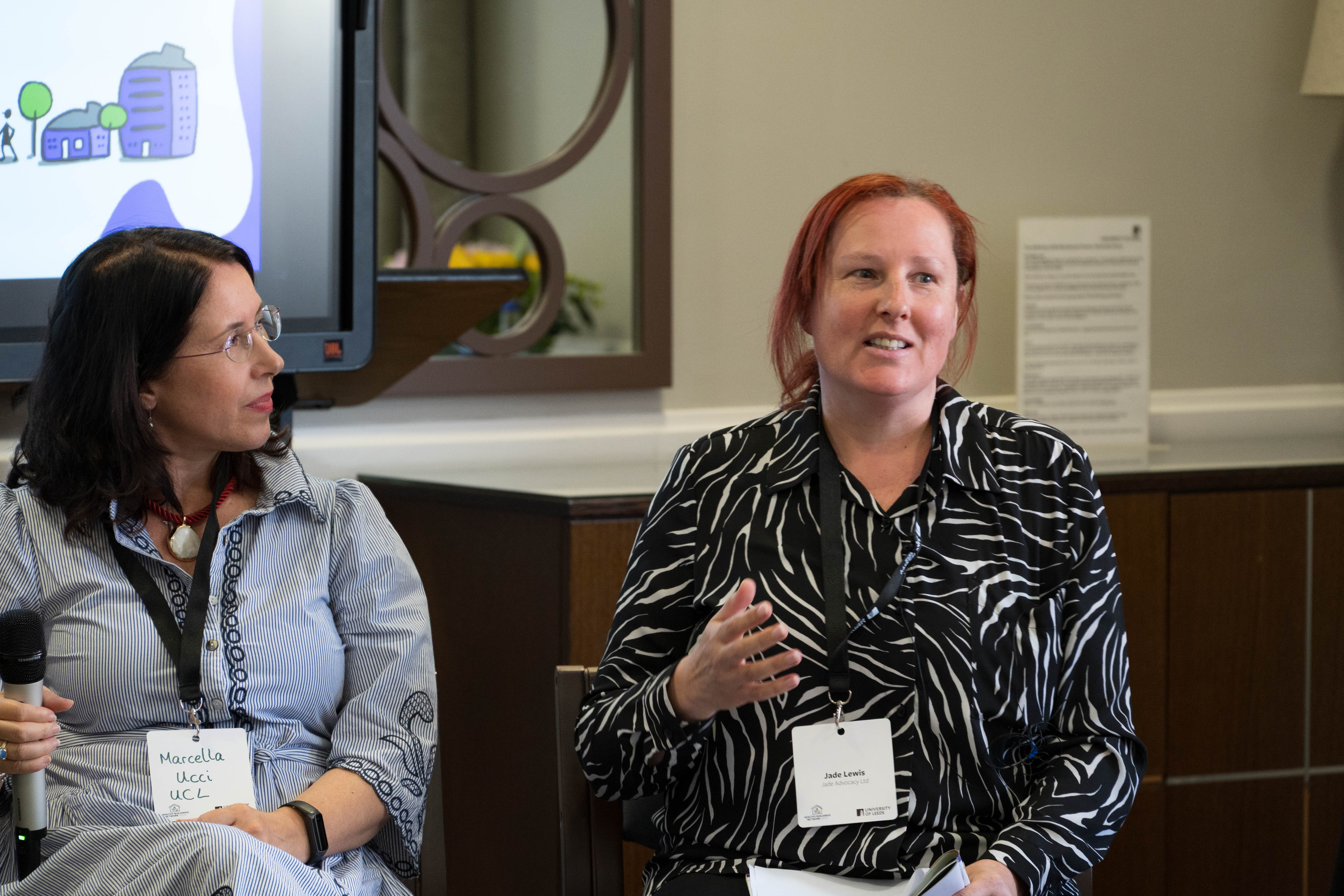Jade Lewis moderating with Marcella Ucci — HBN Showcase 2026 panel discussion