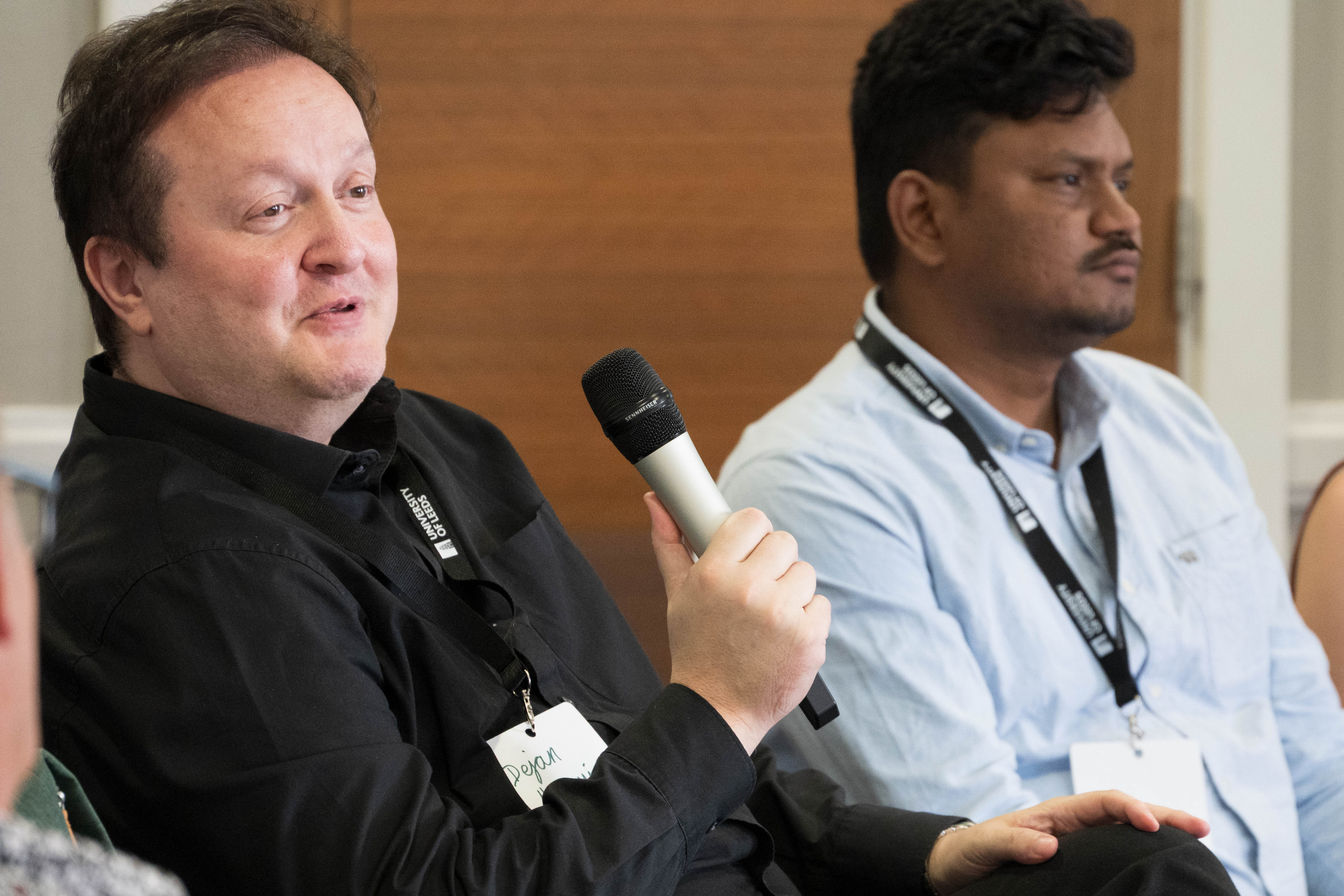 Dejan Mumovic speaking at the HBN Showcase 2026 panel, Akash Biswal beside him