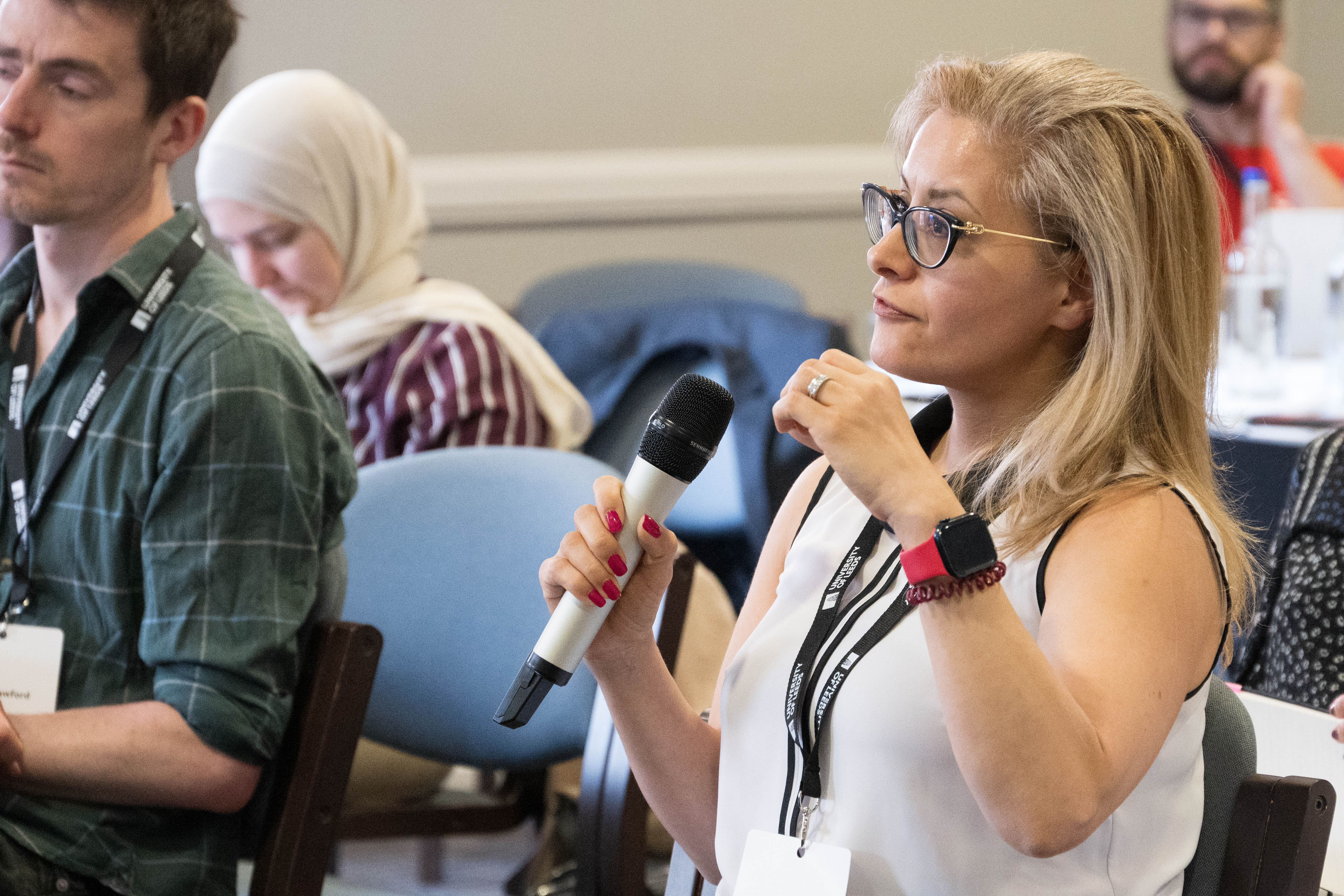 Audience member asking a question during the panel