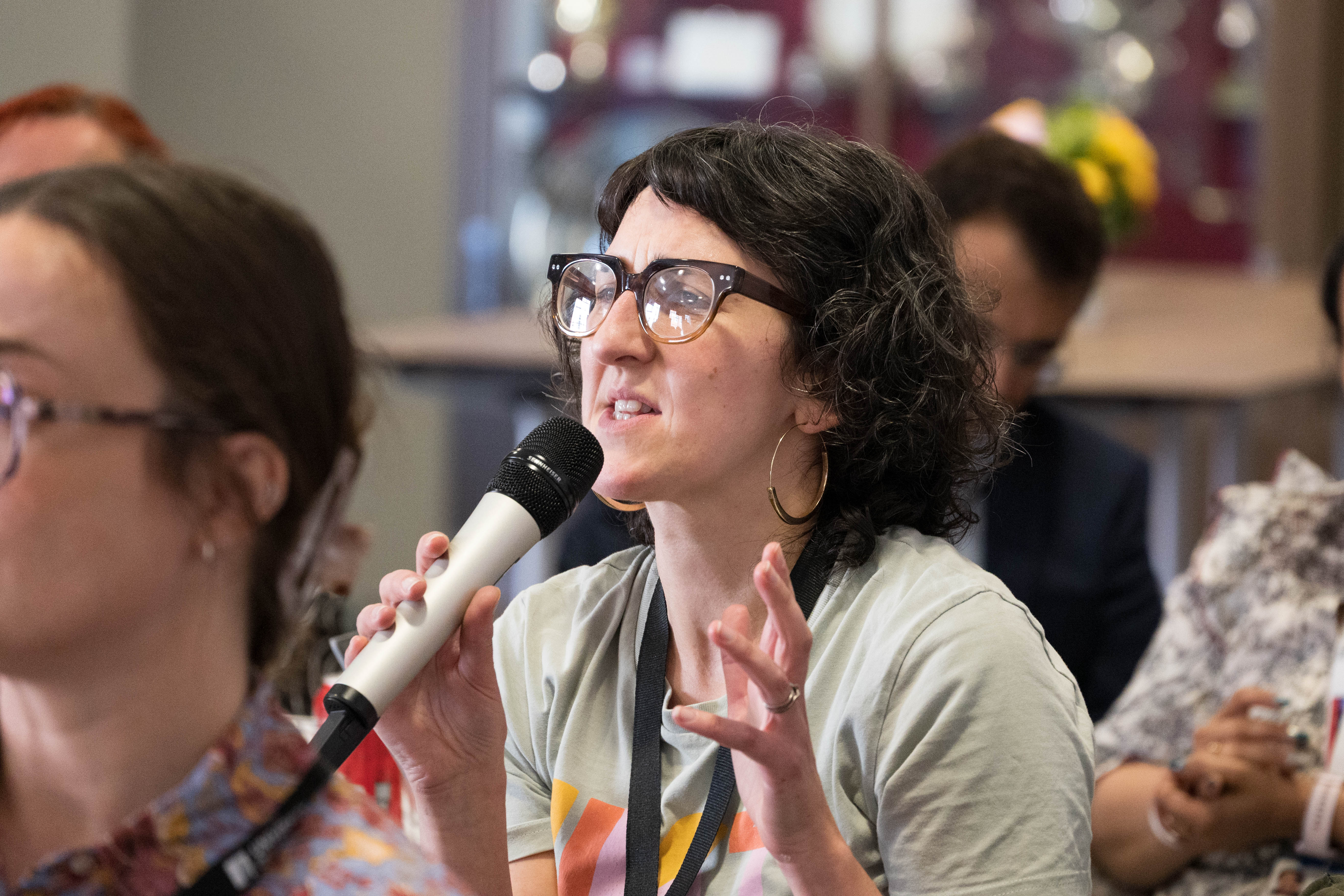 Audience member contributing during discussion